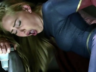 A blonde is in the Supergirl parody where...